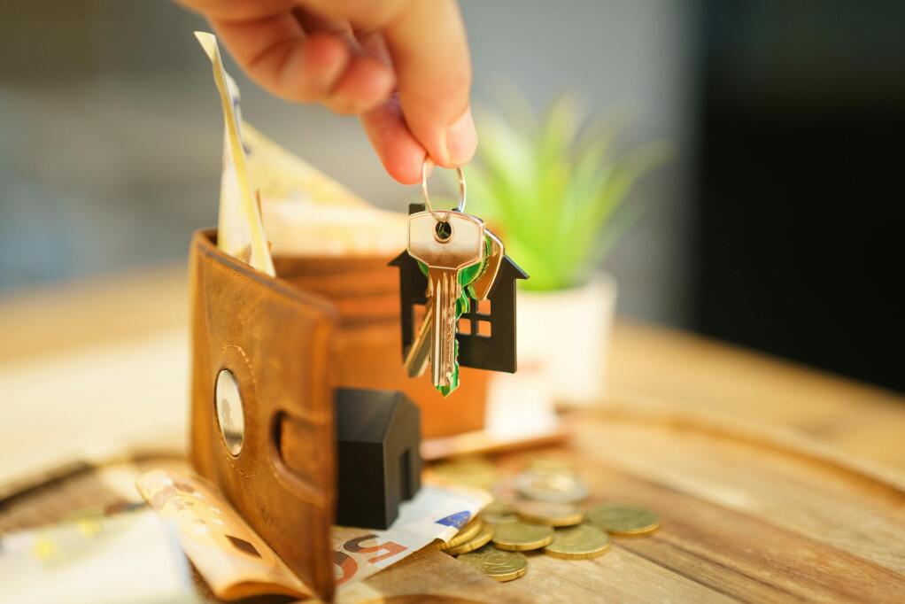 close up of hand holding a house
